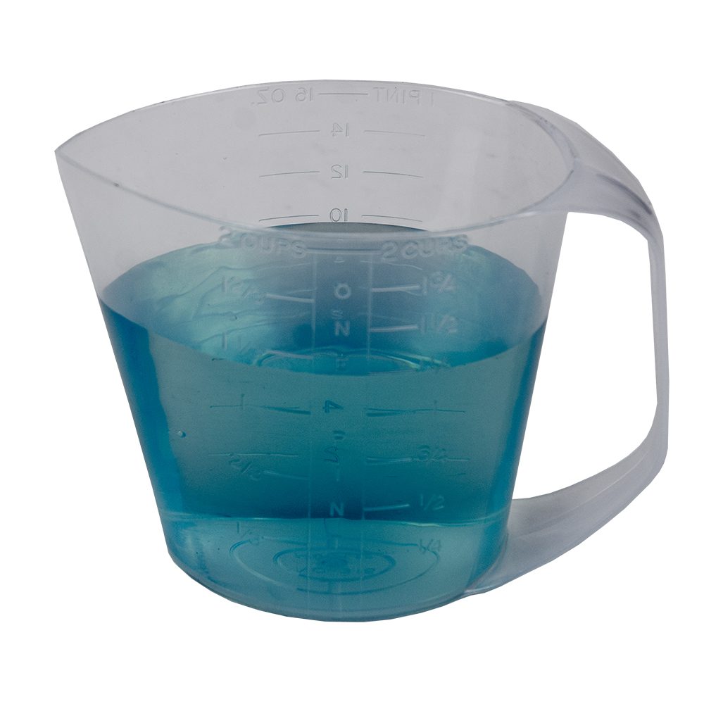 A blue liquid in a measuring cup.