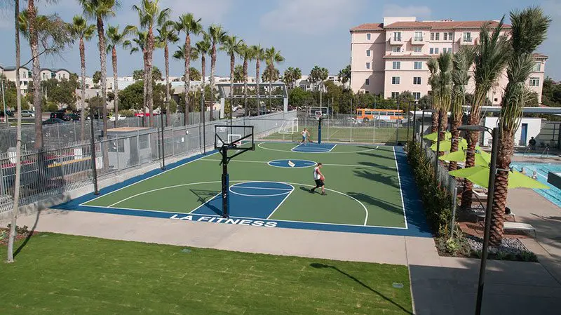 A man is playing basketball on the court